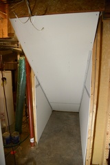 Under stairway drywall